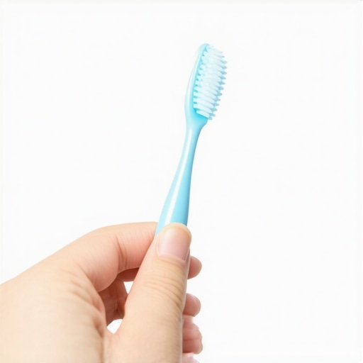 Close-up of the correct rice-grain-sized amount of toothpaste on a toddler's toothbrush.